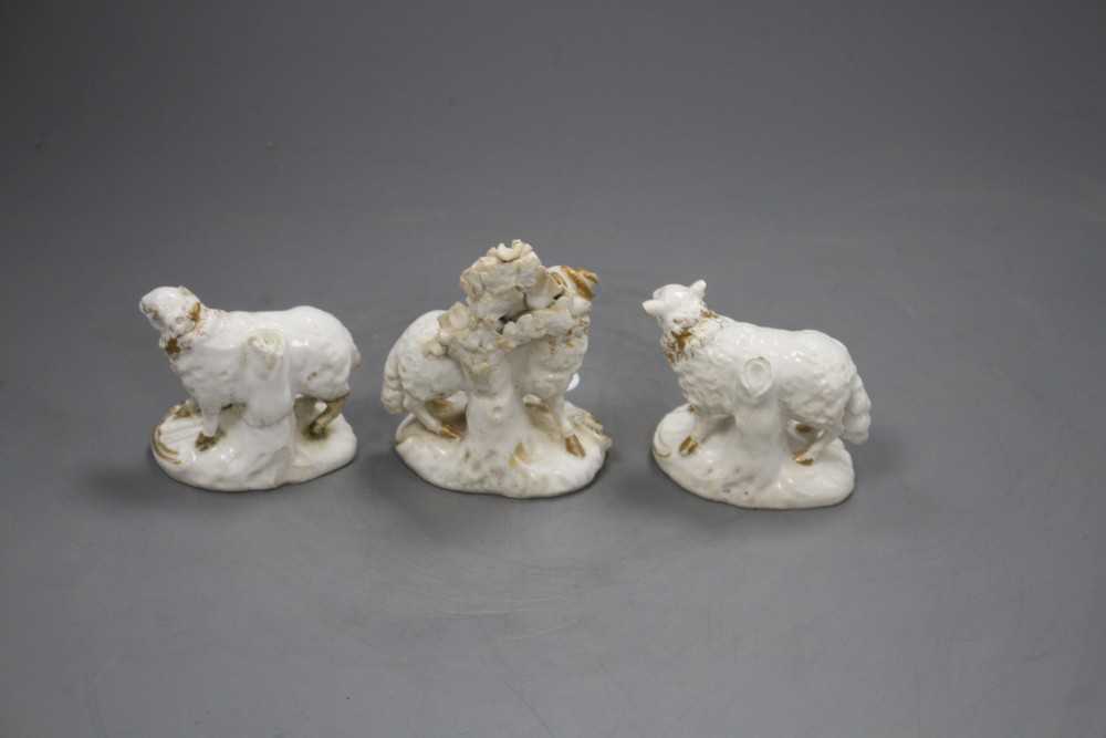 A pair of Derby gilt and white figures of a ram and a ewe, and an additional ewe, c.1810-30, h. 6.3 - 8cm (3)